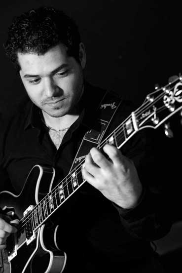 Domenic Bello playing guitar